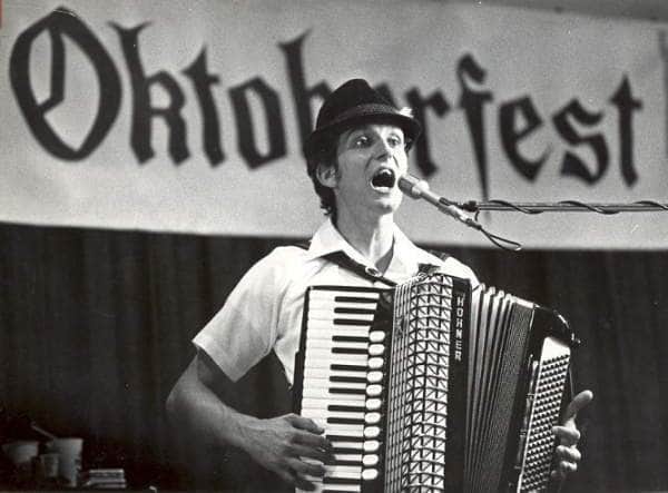 Black and white file photo. Mike Farrenkope on accordian. 4th member of Die Musikanten, a local band. Also in band (not pictured) Martin Farrenkopf (bass), Rick Miller (drums), Bill Rees (trumpet).__Fairs and festivals; Oktoberfest; Octoberfest; man singing; man playing accordian._ _accordion ._Columbus Dispatch Magazine, page 12, 8/31/1986.