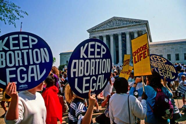 Supporters for and against legal abortion face off during a protest outside the United States Supreme Court Building, Washington